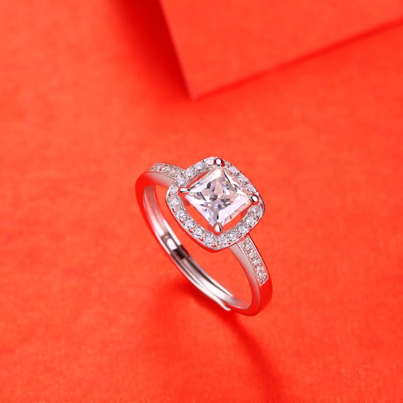 1ct Moissanite Square Framed Adjustable Engagement Ring in 925 Sterling Silver on a red background