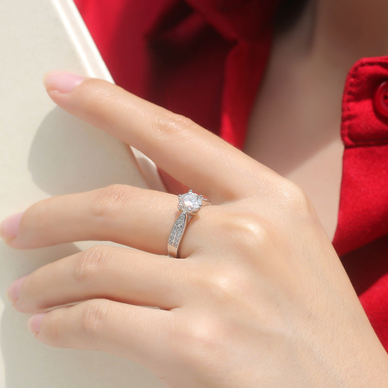 Woman wearing the 1ct Moissanite Frosted Band Adjustable Engagement Ring in 925 Sterling Silver