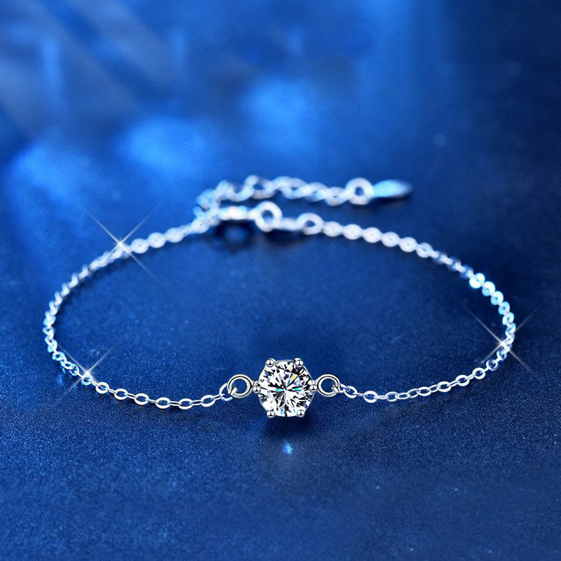 1 carat Round Cut Moissanite Bracelet in 925 Sterling Silver ina  blue background