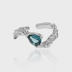 Image of the Blue Pear Cut Cubic Zircon Adjustable Ring in 925 Sterling Silver in a light grey background