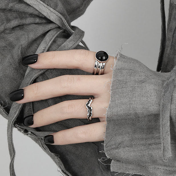 image of the Black Agate Unisex Adjustable Ring in 925 Sterling Silver on a woman's left hand index finger