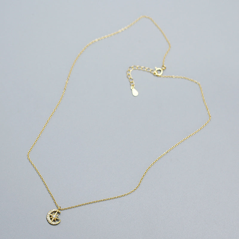 18k gold plated Crescent Moon & Star Zircon Necklace in 925 Sterling Silver in a grey background